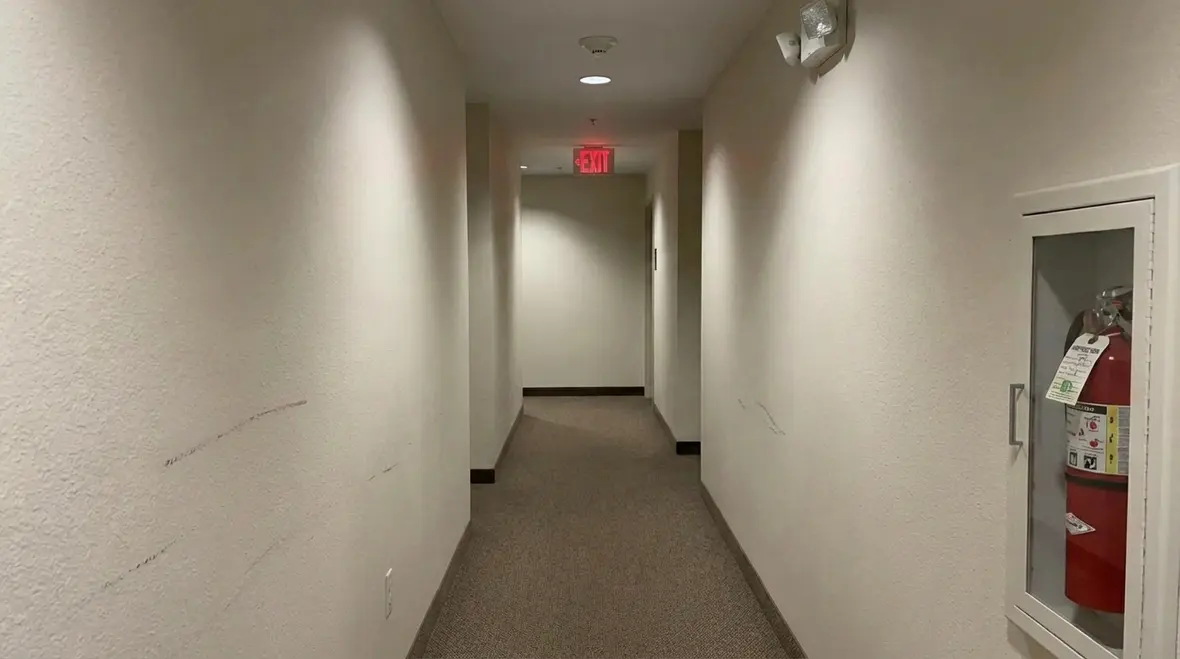 Hotel staff inspecting fire safety equipment