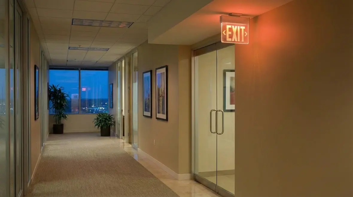 Combo exit sign emergency light installed in warehouse