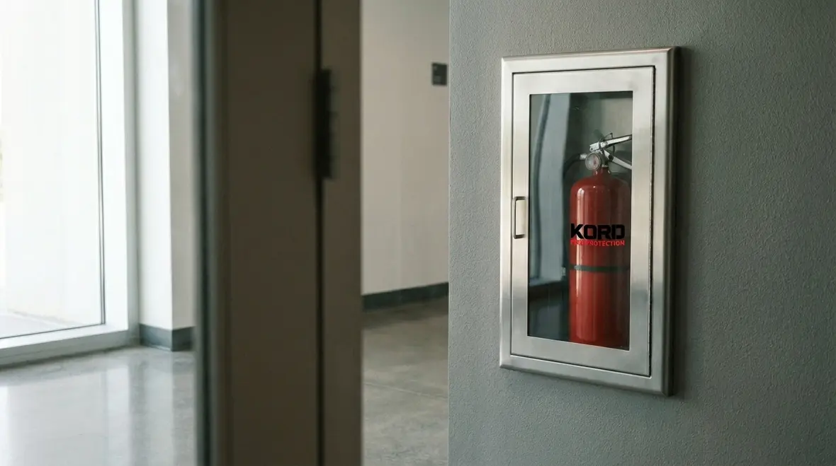 Close-up of a wall-mounted fire extinguisher cabinet