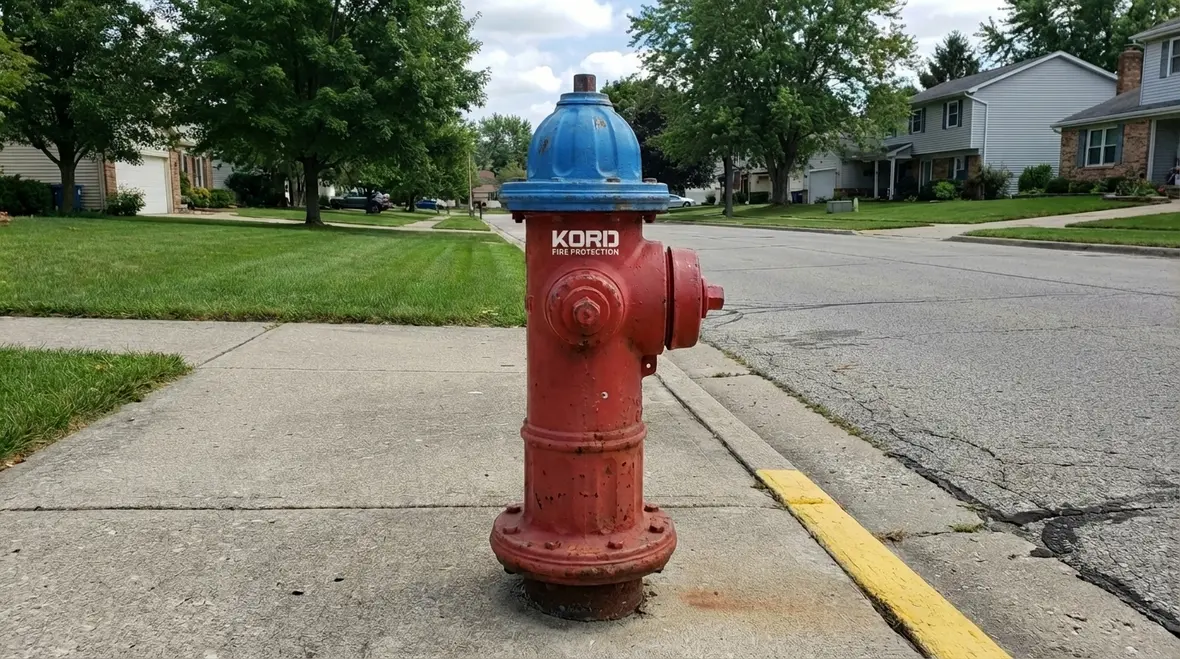 Street of red and yellow fire hydrants lined up