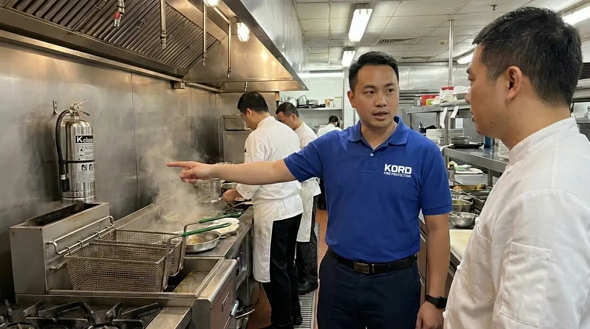 K class fire extinguisher mounted in a commercial kitchen