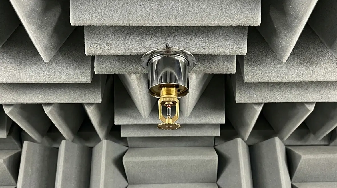 Retractable sprinkler heads protecting anechoic chamber