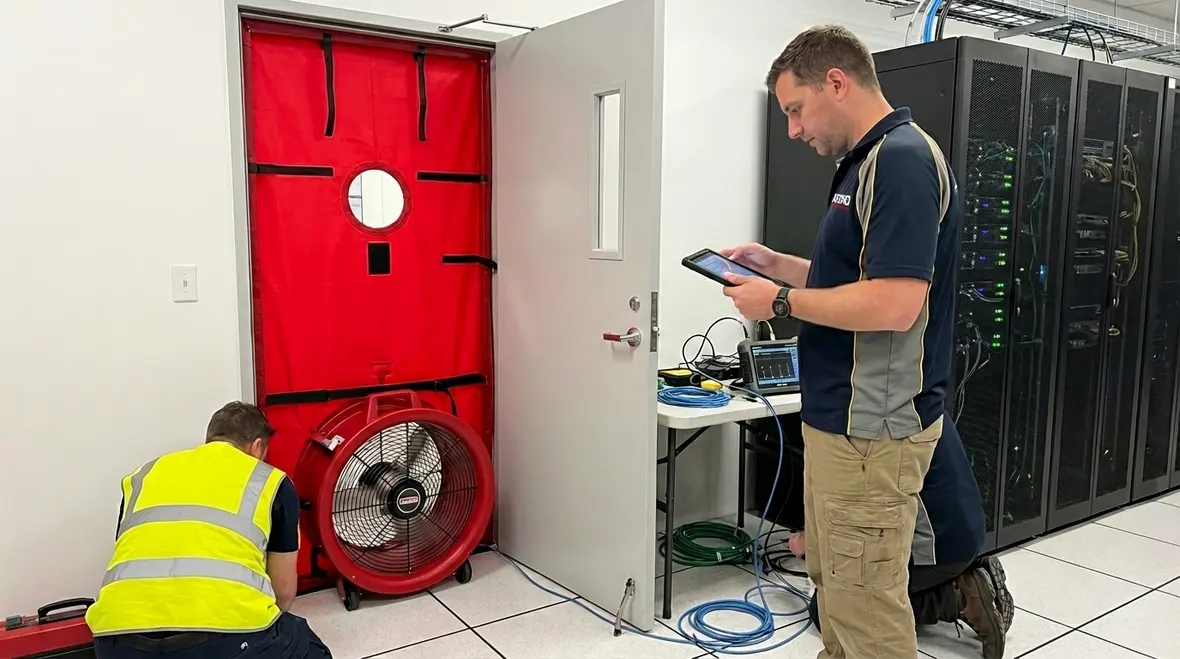 Room integrity testing for gas based fire systems
