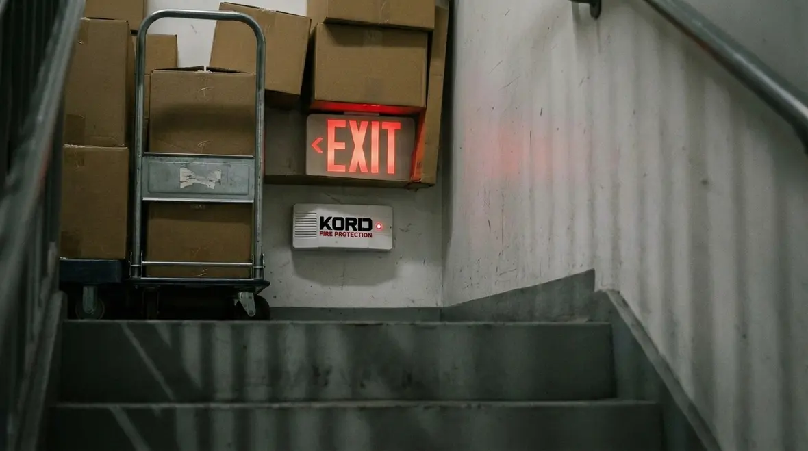 West Hollywood property manager reviewing egress lighting documentation