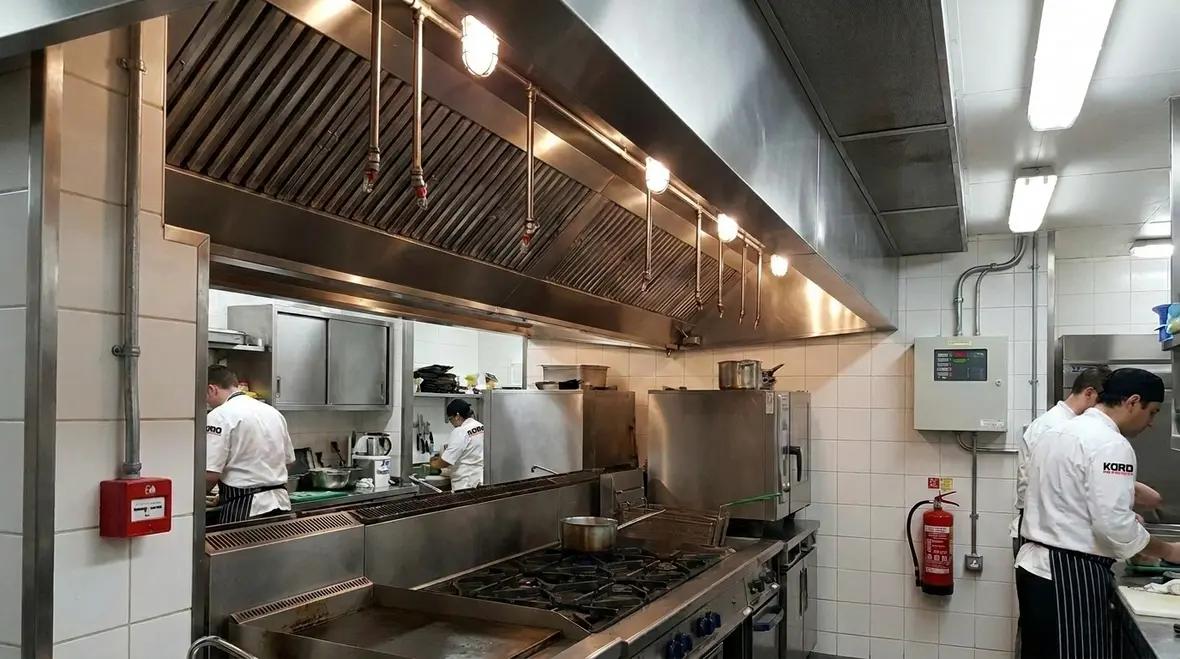 Kitchen suppression fire alarm tie in planning in a commercial kitchen
