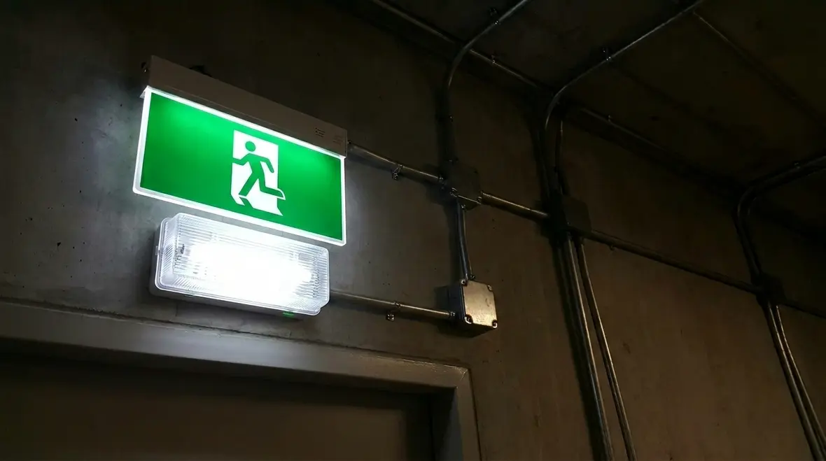 Emergency lighting for fire exits in a commercial corridor