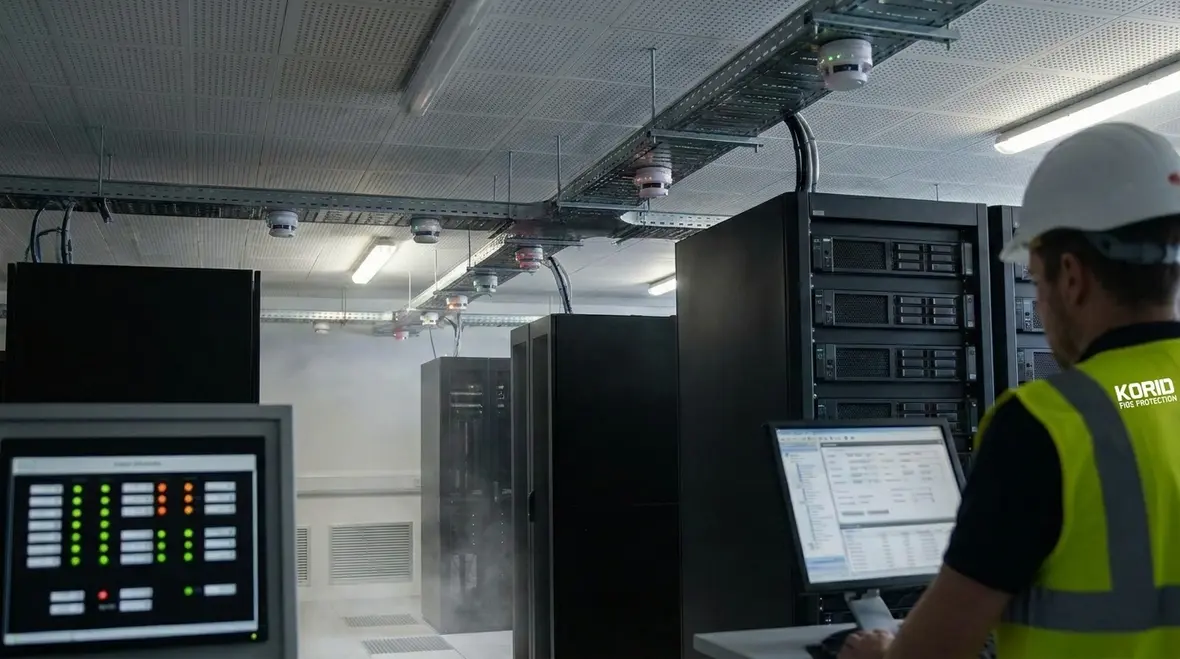 Engineers planning advanced detection and suppression architecture in a data center
