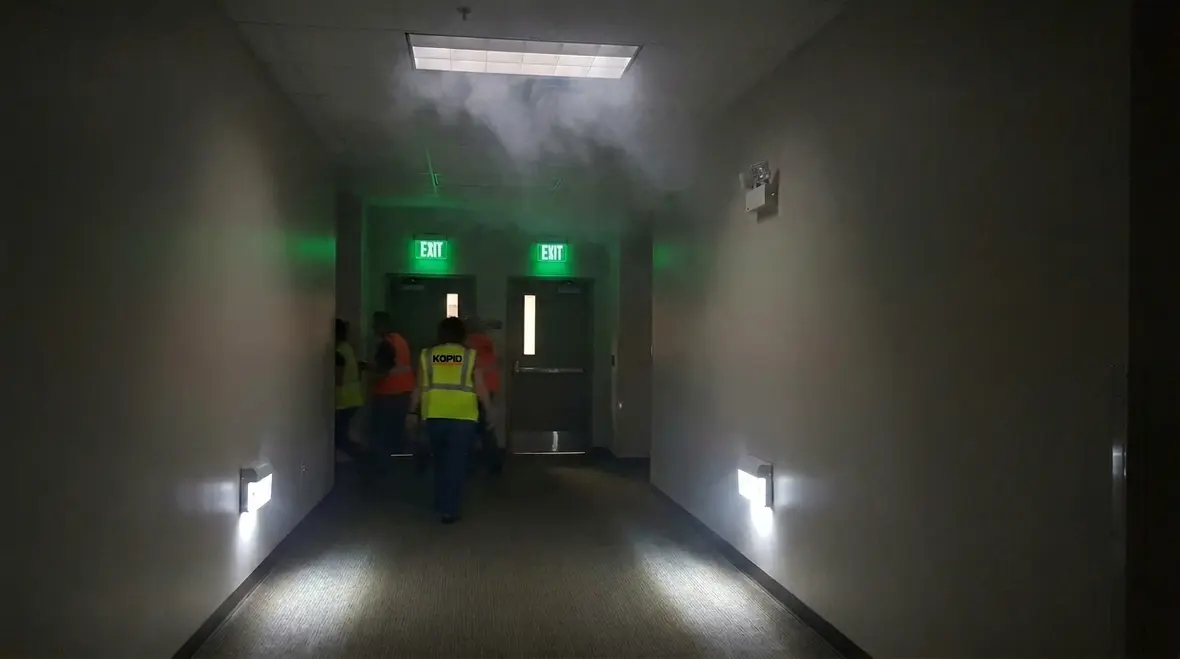 Emergency lighting for fire safety in a commercial facility