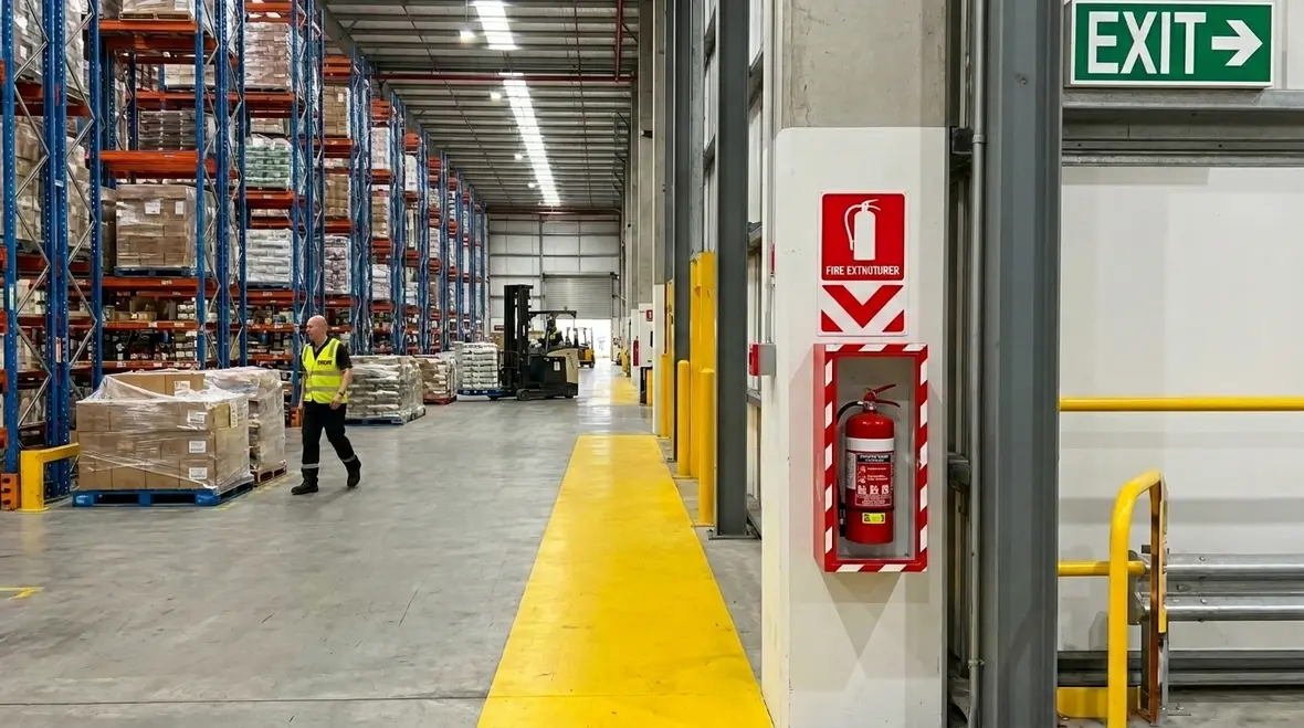 Portable fire extinguisher mounted in a commercial facility for strategic placement planning