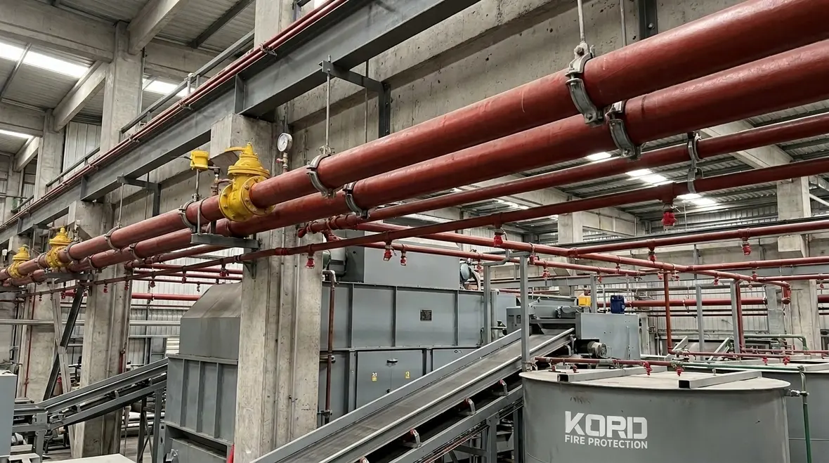 NFPA 15 piping requirements for water spray systems in an Australian industrial facility