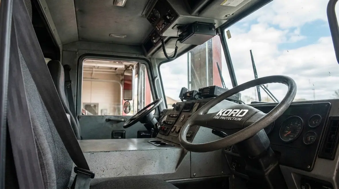 Driving compartment layout inside a fire apparatus cab