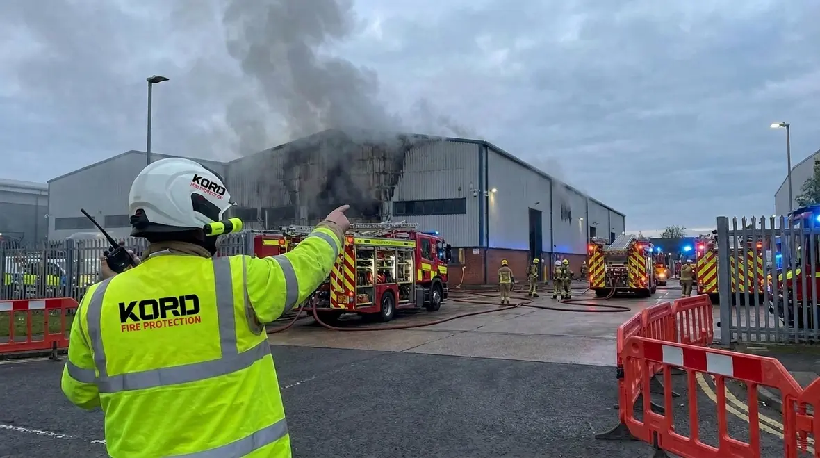 Incident commander directing fire scene operations at a commercial facility