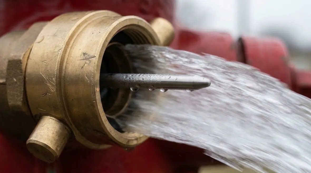 Hydrant flow testing setup with pressure measurement equipment