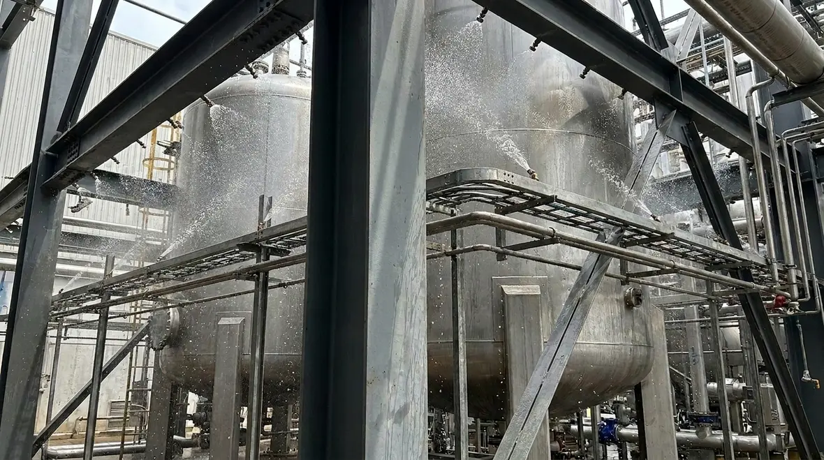 NFPA 15 Section 7.4 exposure protection densities for vessels, structural steel, and piping racks