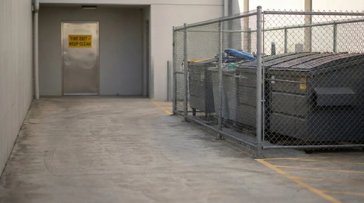 Refuse storage planning area with controlled bin placement and clear access paths