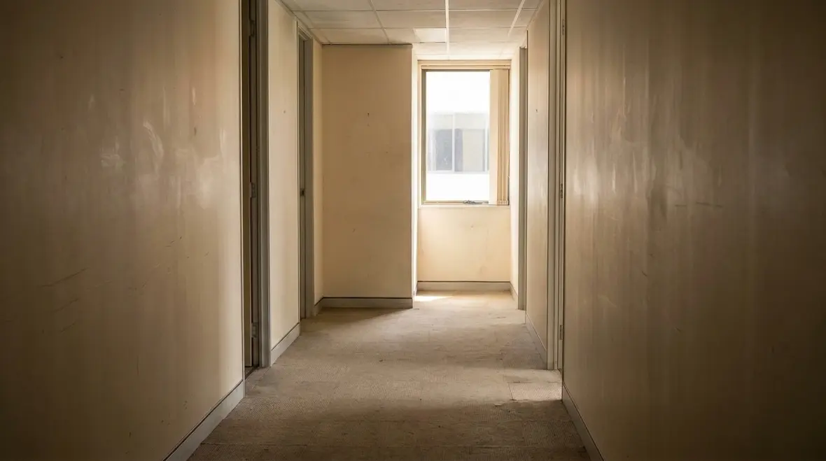Commercial corridor with visible egress marking and exit sign placement