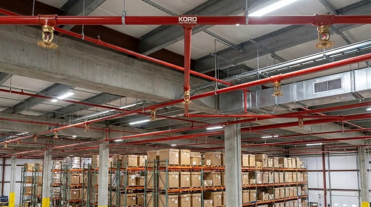 Foam-water sprinkler spacing and location in commercial fire protection systems
