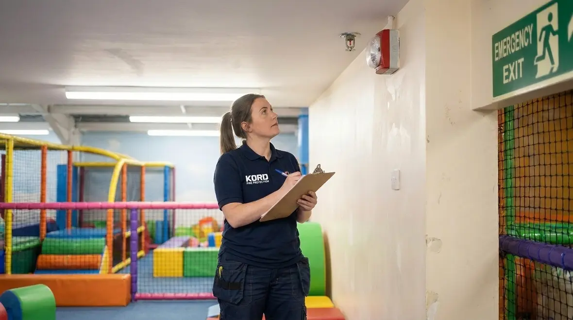 Children play area fire safety planning inside a busy commercial indoor playground