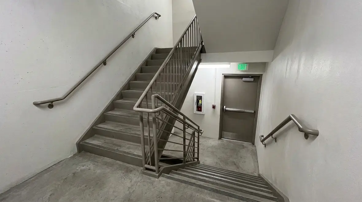 Stair enclosure fire protection in a commercial exit stairway
